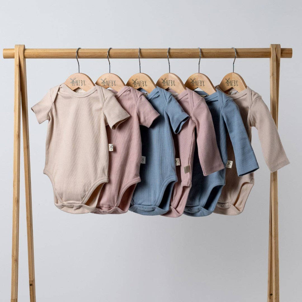 
                  
                    Short Sleeve Bodysuit: Dusty Pink
                  
                