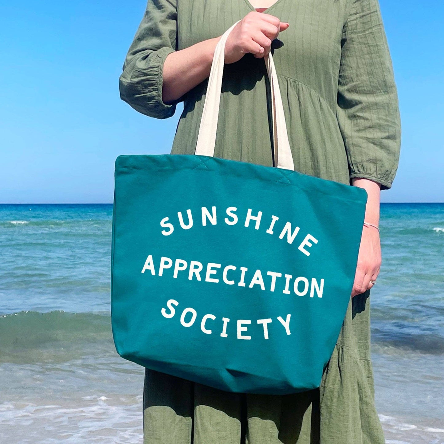 
                  
                    Sunshine Appreciation Society - Tropical Blue Canvas Tote Bag
                  
                