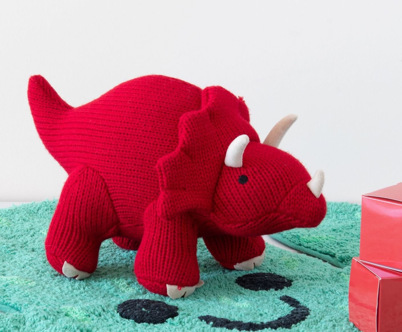 
                  
                    Knitted Red Triceratops Dinosaur Toy - 'TOMMY'
                  
                